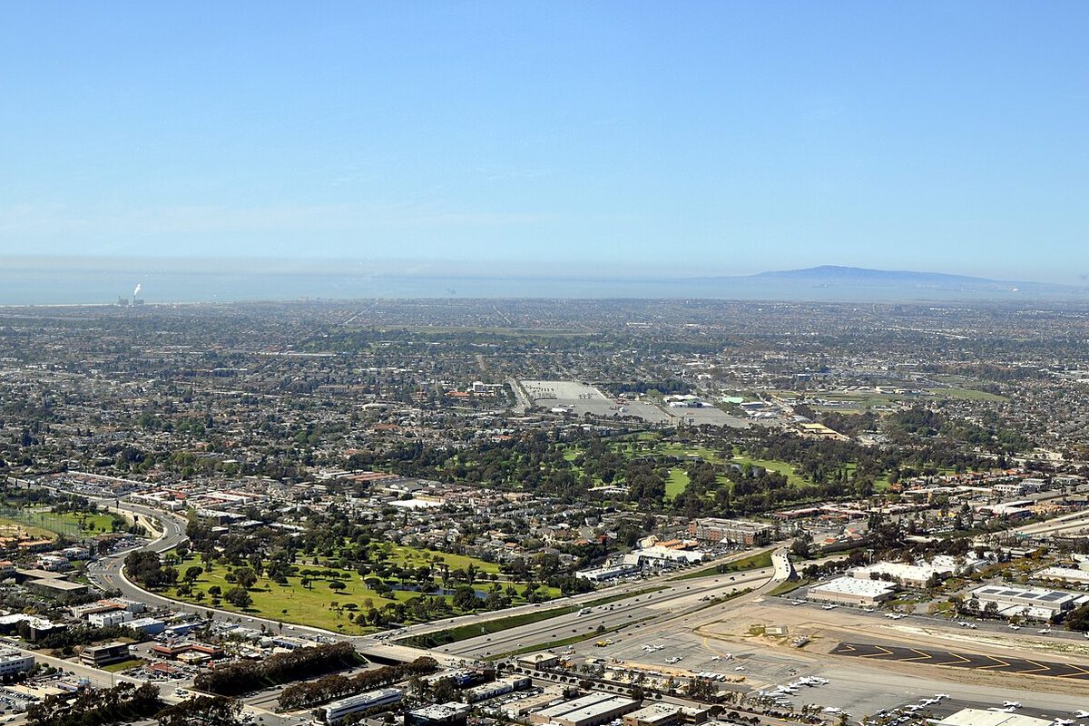 Aerial view over Costa Mesa, California, with the coast on the horizon