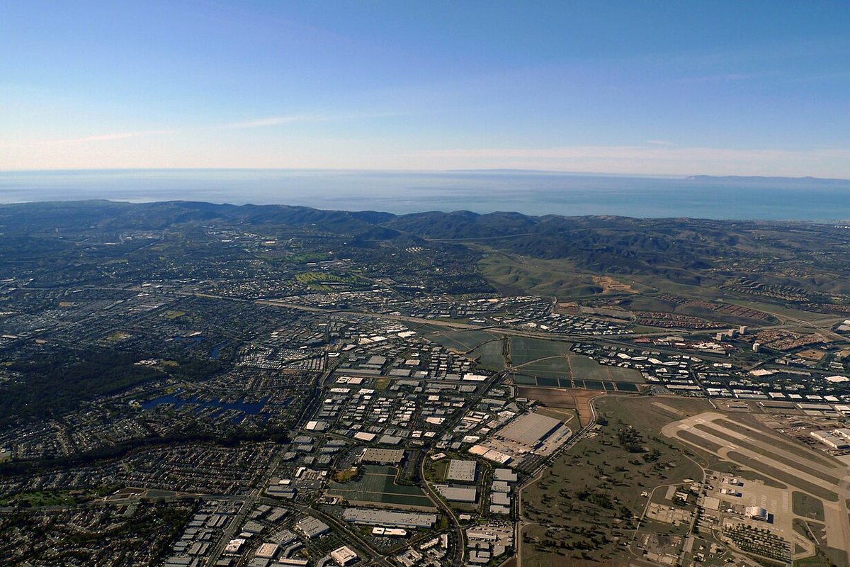Aerial view over Lake Forest and Laguna Hills, California, toward the Pacific Ocean